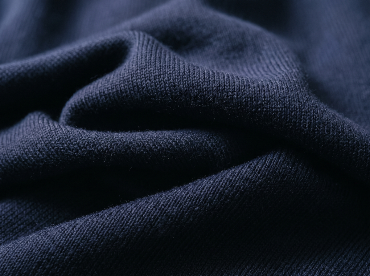 Close-up of fine-gauge navy merino wool knit